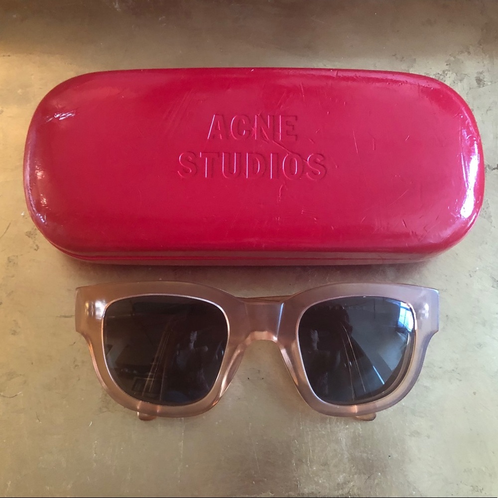 Acne sunglasses with case.